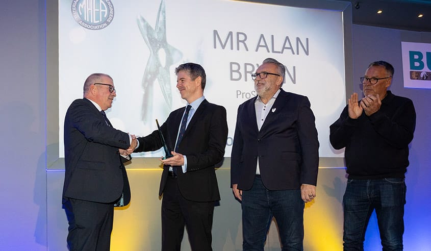 (Pictured: Alan receiving his award from ConSpare’s CEO, James Bullock)